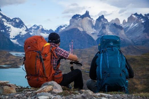 Two men hike in Parque Torres Del Paine, Patagonia with the Mountainsmith Apex 60. Apex 80 and Pyrite trekking poles