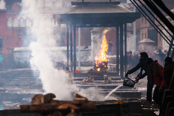 Man puts out small fire in Kathmandu, Nepal