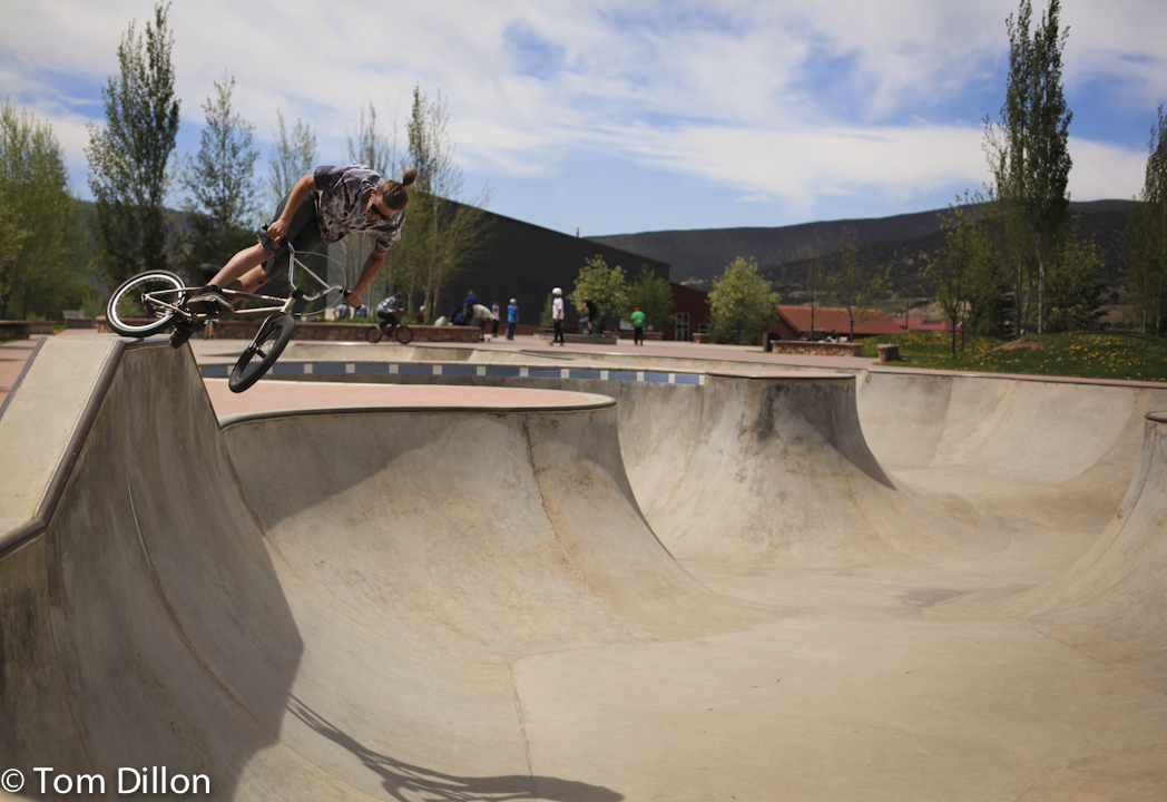 Cody Landers riding a concrete bowl on his bmx bike in edwards, co