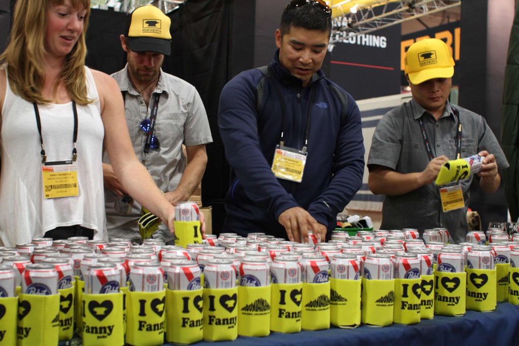 PBR tall boys lined up on a table in Mountainsmith coozies