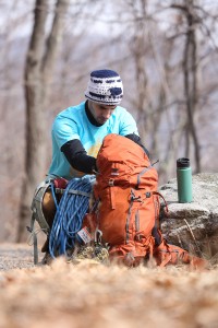 Chris Vultaggio digging through the Mountainsmith Mayhem 35 backpack