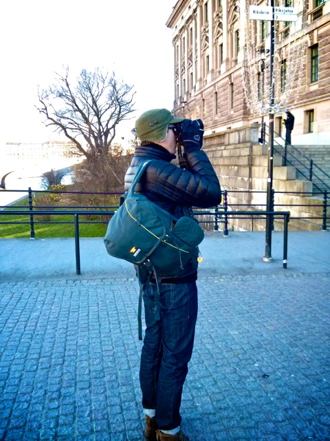 Dan Roby snaps a photo while carrying the Mountainsmith Spectrum camera backpack