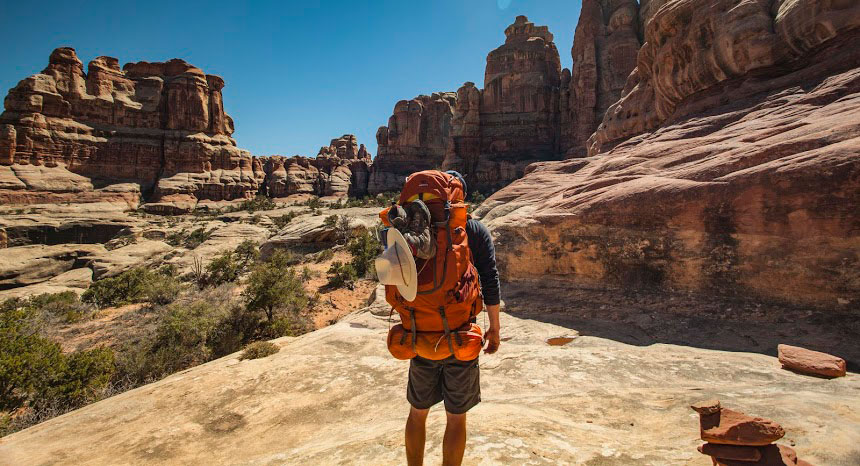 Man carries Mountainsmith backpack in Canyonlands Naitonal Park, Utah