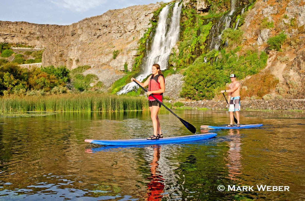 Jessica Florian and Elijah Weber riding the Standup Paddle Board at Thousand Springs in the Snake River Canyon near the city of Hagerman in southern Idaho, Mark Weber Photo