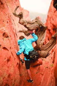 Luke Boldman hiking through a canyon with the Mountainsmith Day TLS lumbar pack
