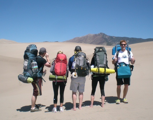 The crew from Denver embarks on their hike at Colorado’s Great Sand Dunes National Park with a Juniper 55 Ghost 50 Morrison 2 and Deluxe Cooler Cube