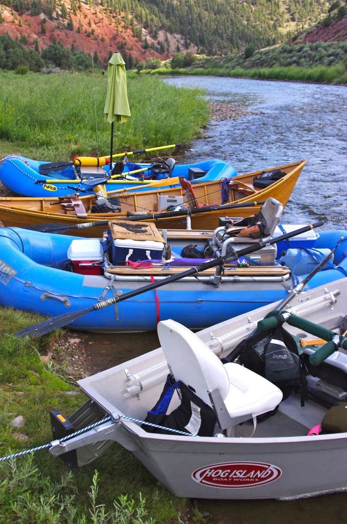 four boats on the bank of the colorado river