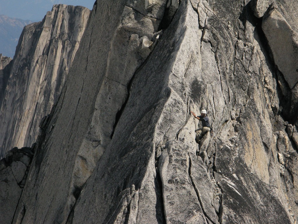 A climber  on a rock face in the Bugaboos of British columbia