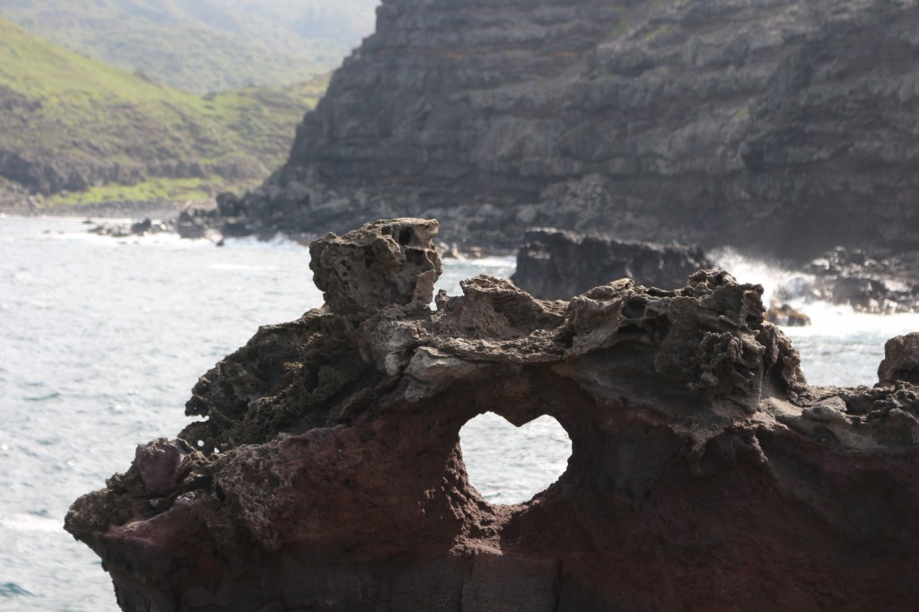 A heart shaped rock formation on the beach in Hawaii
