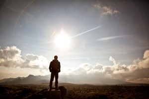 Garrett Adrian stands on the summit of Kilimanjaro