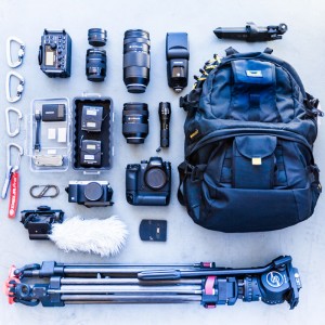 Inventory of camera gear laid out on floor