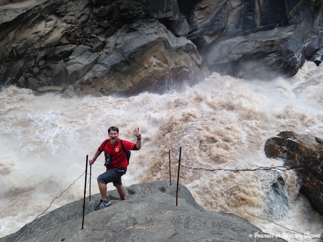 Mountainsmith Ambassador on the famous rock at Tiger Leaping Gorge