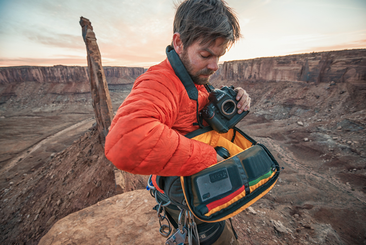 Andy Mann works out of his Mountainsmith Descent camera sling bag on Notch peak in Utah