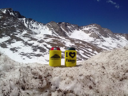 Mountainsmith koozies in front of the couloir that was skied on Mt. Evans