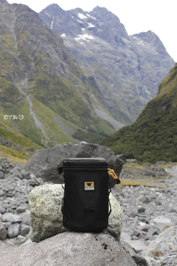Mountainsmith lens case sitting on a rock in the middle of the mountains of New Zealand 