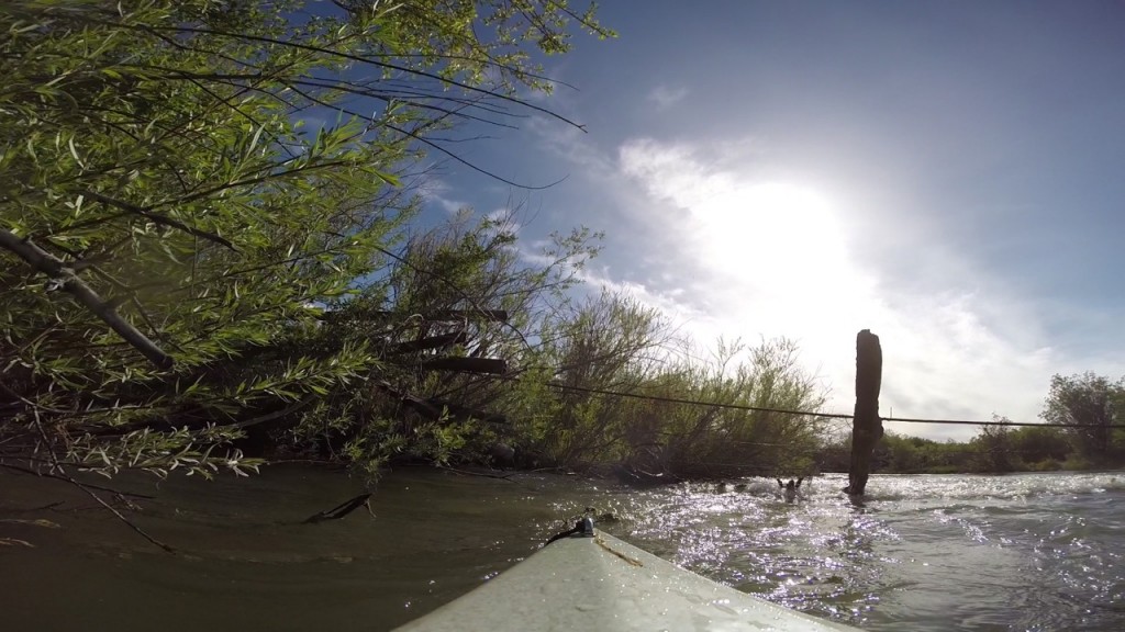 Blackwater Drifters kayak approaches barbed wire in the Red Rock River