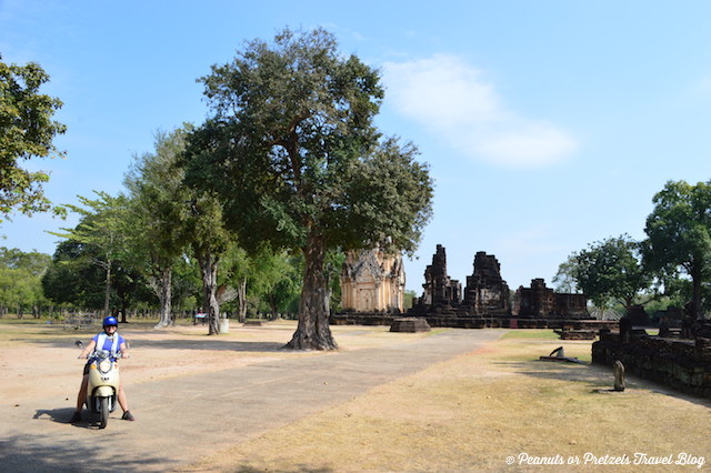 Liz Wilson from Peanuts or Pretzels travel blog riding a bicycle around Sukhothai Thailand 
