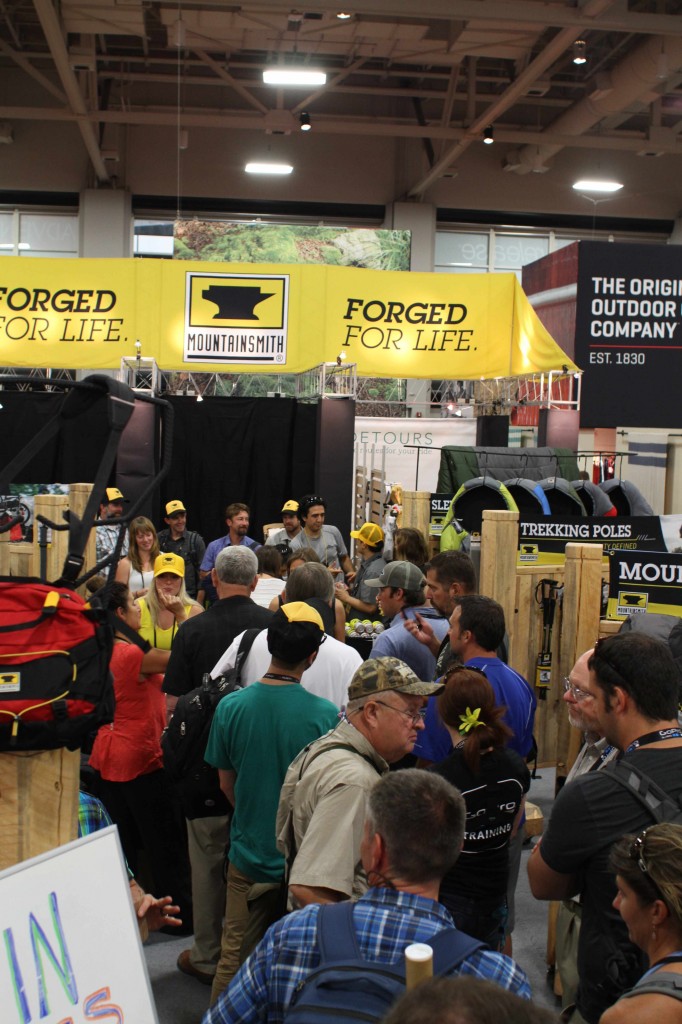Outdoor Retailer attendees wait to buy a backpack at the Mountainsmith booth