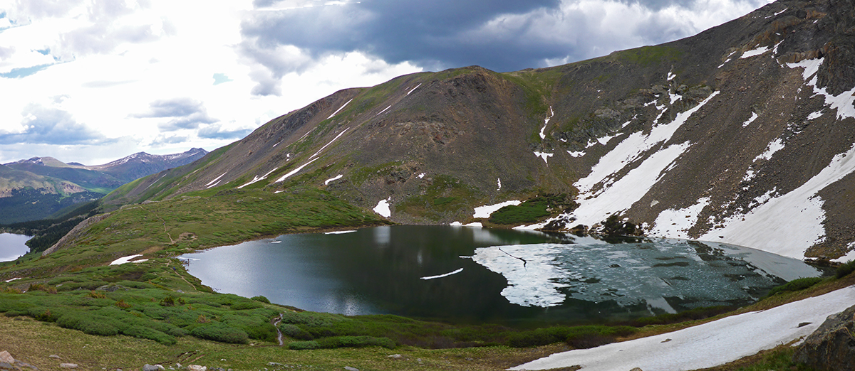 Ice still floating on the alpine lake in colorado