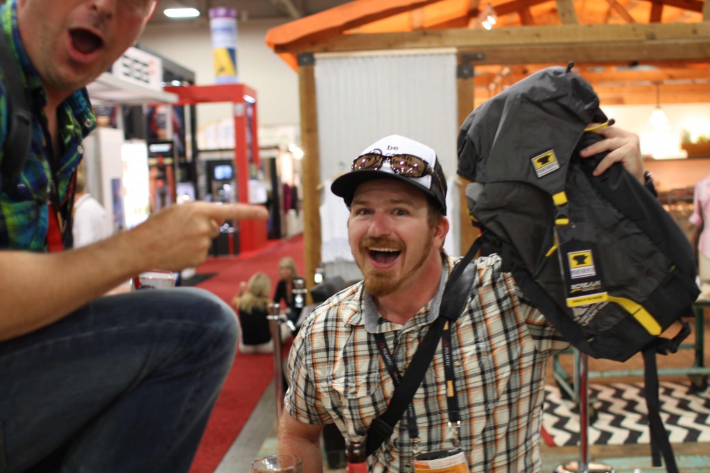 Party goer shows his new Scream 25 backpack with the AAC logo