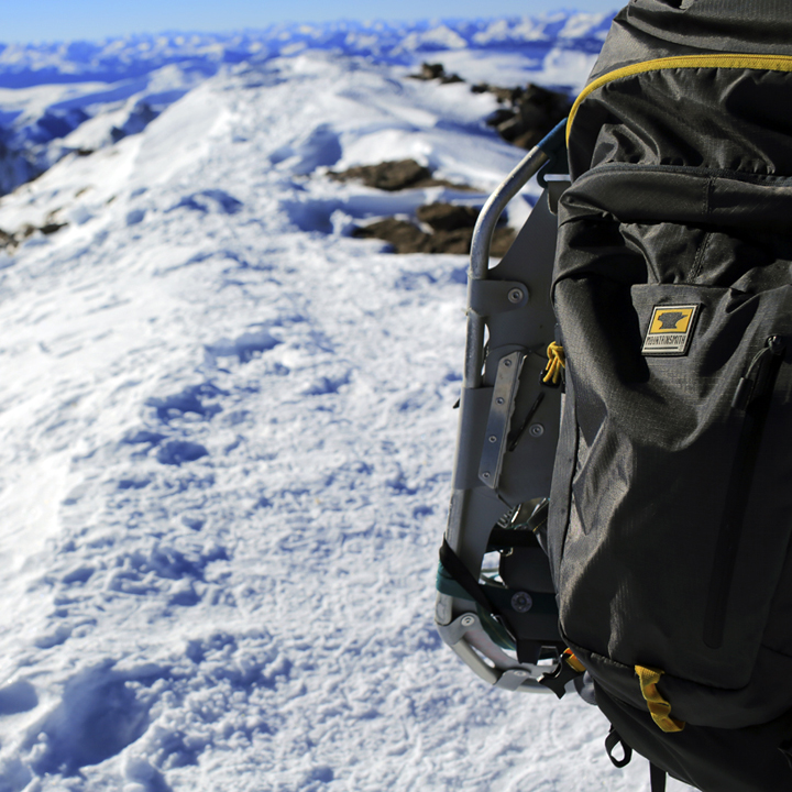 The Mountainsmith Ghost 50 carrying snowshoes on top of Quandary Peak in the Colorado winter
