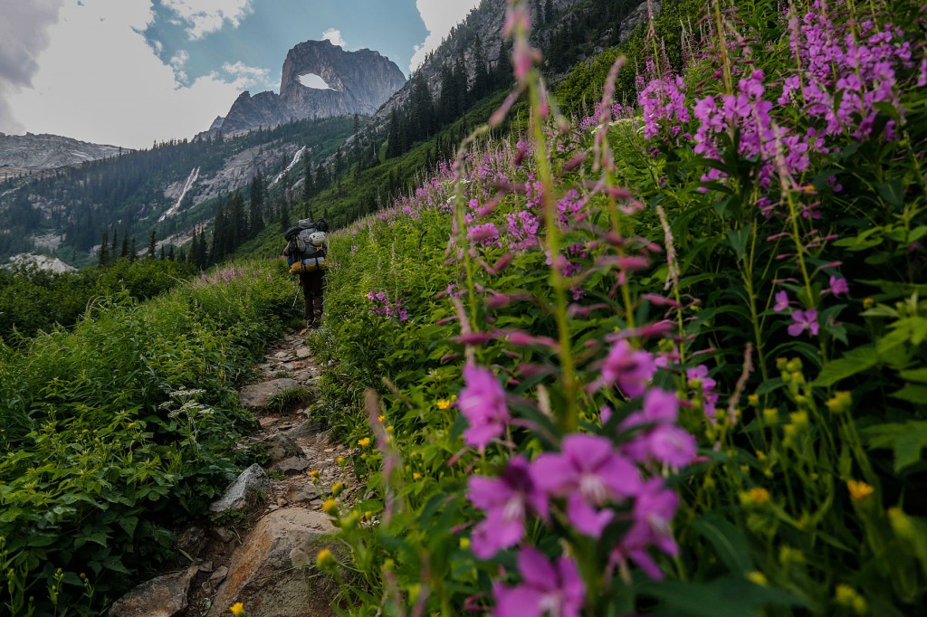 A hiker walks the Bugaboo Approach with the Mountainsmith Mystic 65 backpack