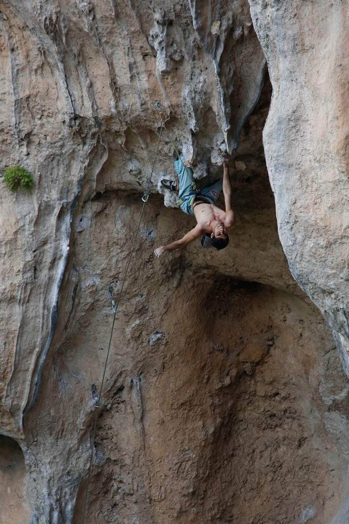 a climber bending backwards on a wall in Turkey