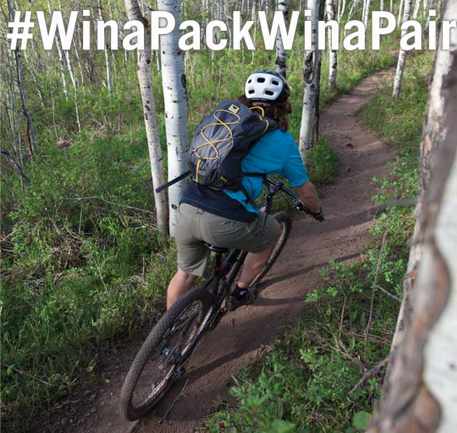 Mountain biker using the Mountainsmith Spirit 12 #winapackwinapair