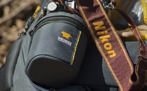 Mountainsmith lens case next to a nikon strap