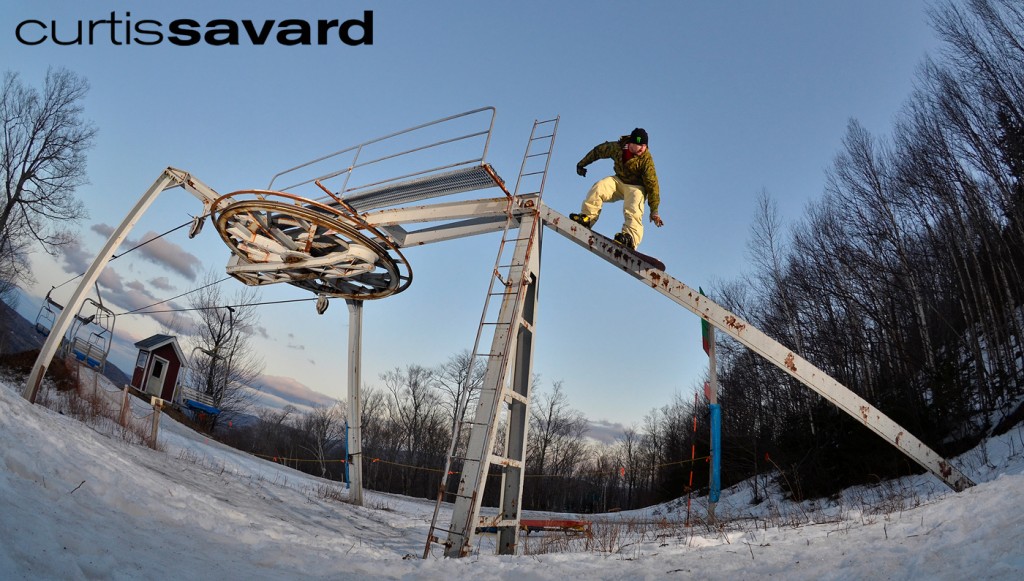 snowboarder sliding down an old ski lift in vermont shot by curtis savard