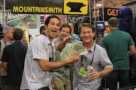 Jay Getzel gives cash to the AAC American Alpine Club on behalf of Mountainsmith at the Outdoor Retailer Summer Market show in July of 2012
