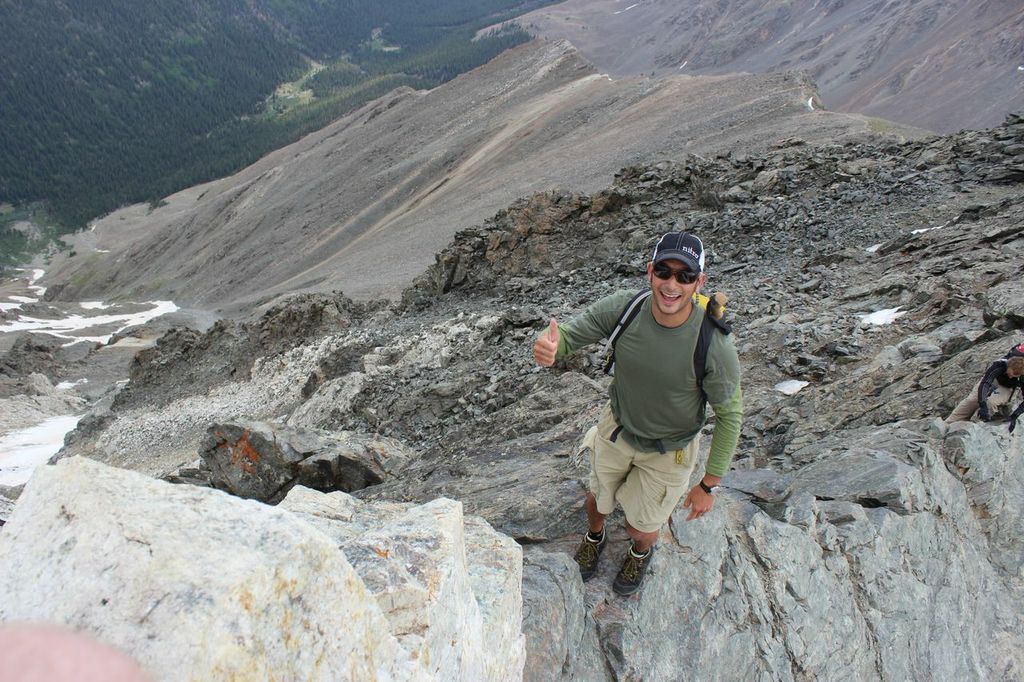 President of Mountainsmith Jay Getzel stands on a knife-edge route on Kelso Ridge