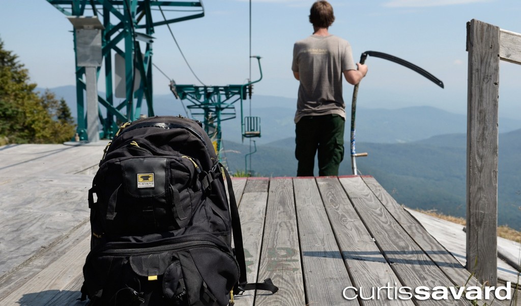 The Mountainsmith Borealis camera backpack sits at the mid-station of Mad River Glen with Curtis Savard in the background