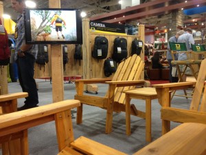Adirondack chairs in the front of Mountainsmith trade show booth for outdoor retailer