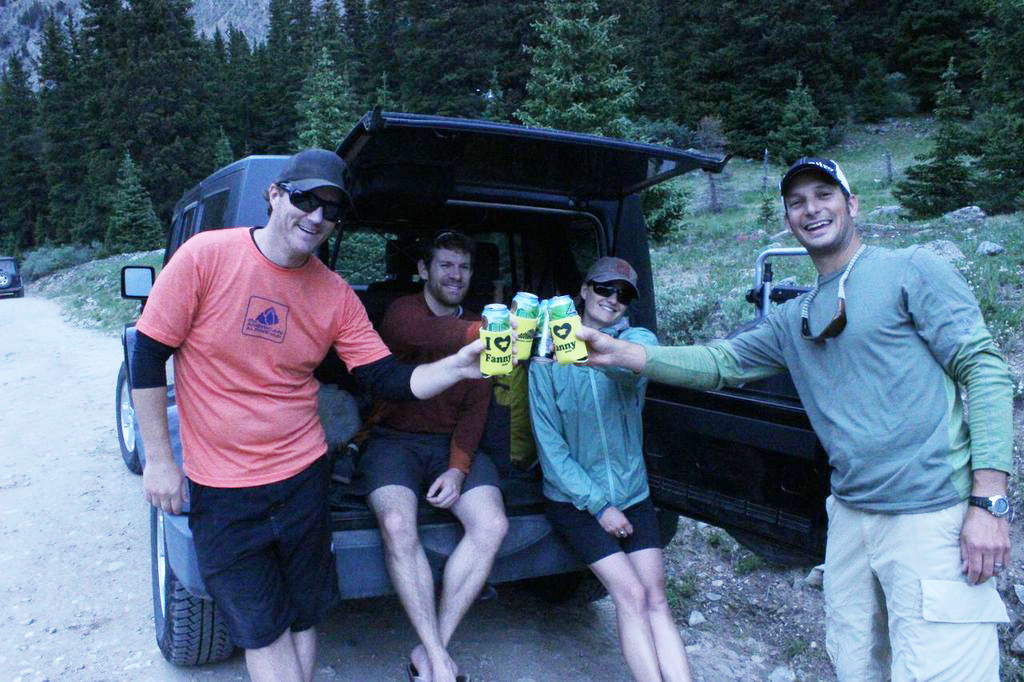 Keegan Young, Erik Lambert, Vickie Hormuth, and Jay Getzel cheers with the new Mountainsmith coozies.