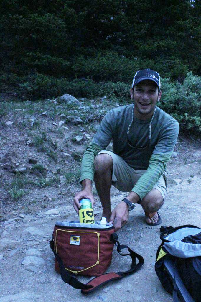 Jay Getzel pulls a beer out of The Sixer cooler from Mountainsmith